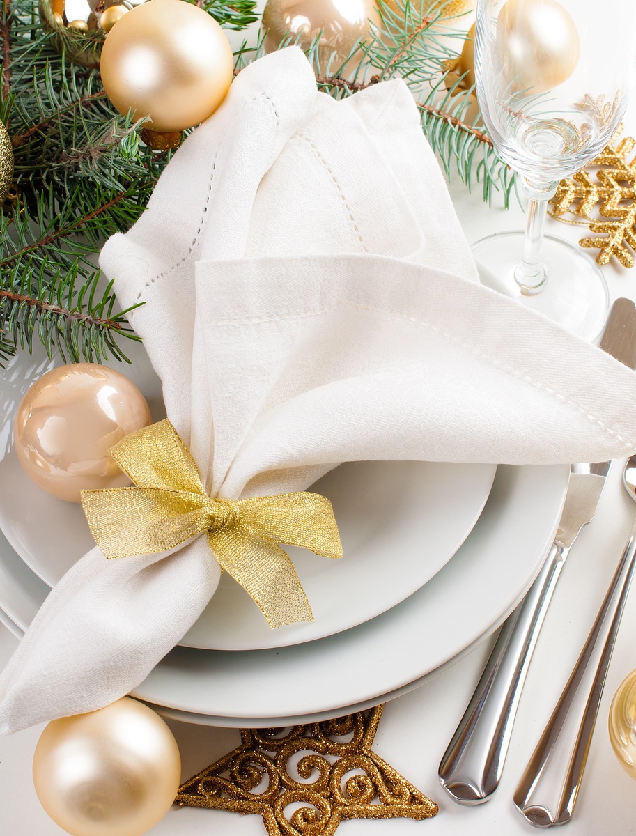 Creating a holiday table setting, tablescape with Erin Busbee, of Busbee Style, Blogger in Telluride, Colorado, using ornaments, gold and silver decorations