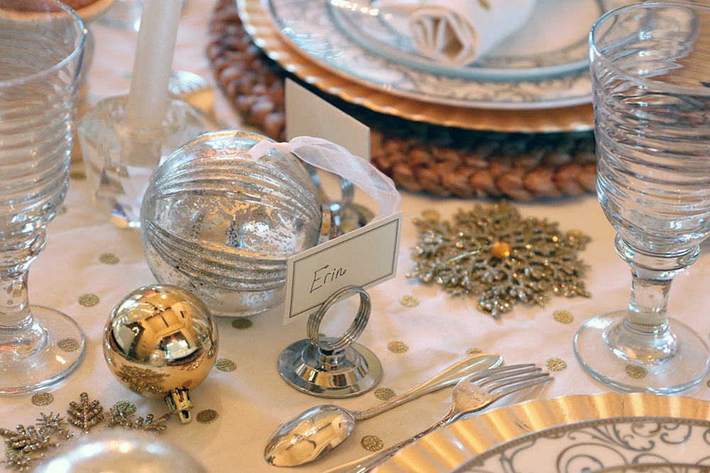 silver and gold holiday table idea that is rustic country and cozy with polka dot napkins from pottery barn and plastic chargers from HEB, ornaments and jute