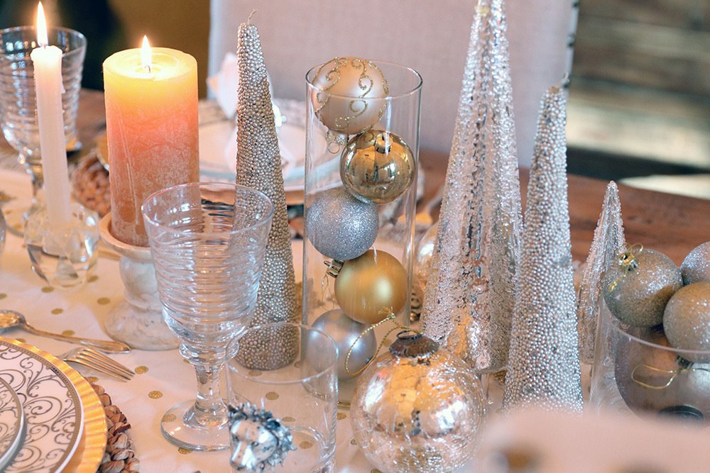 rustic chic decor holiday table setting featuring pottery barn table runner and napkins, silver and gold color theme and lots of ornaments 