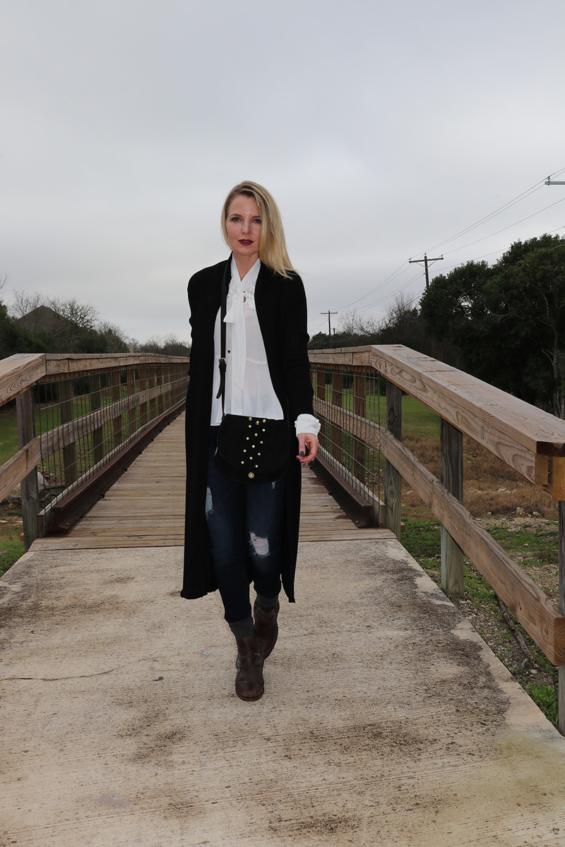 Long black duster cardigan from neiman marcus last call with dark wash skinny jeans slightly distressed by hudson and a white bow blouse by nicole miller