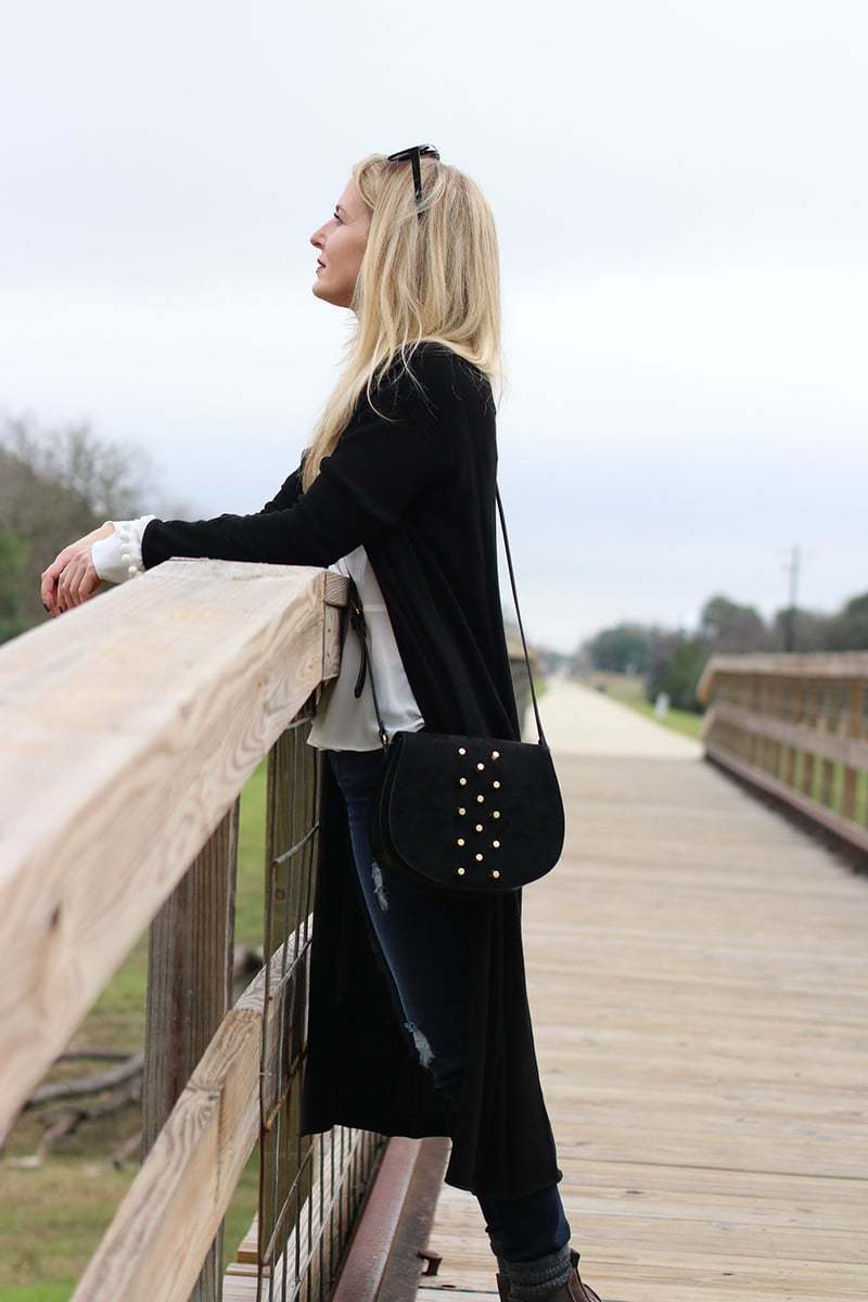 Long black duster cardigan from neiman marcus last call with dark wash skinny jeans slightly distressed by hudson and a white bow blouse by nicole miller