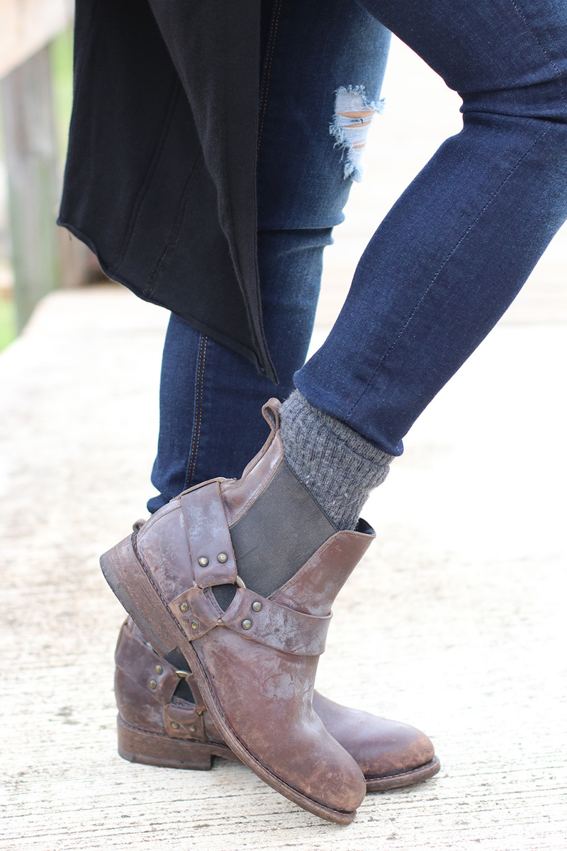weathered frye booties with buckle detail in brown with dark blue skinny jeans slightly distressed by hudson