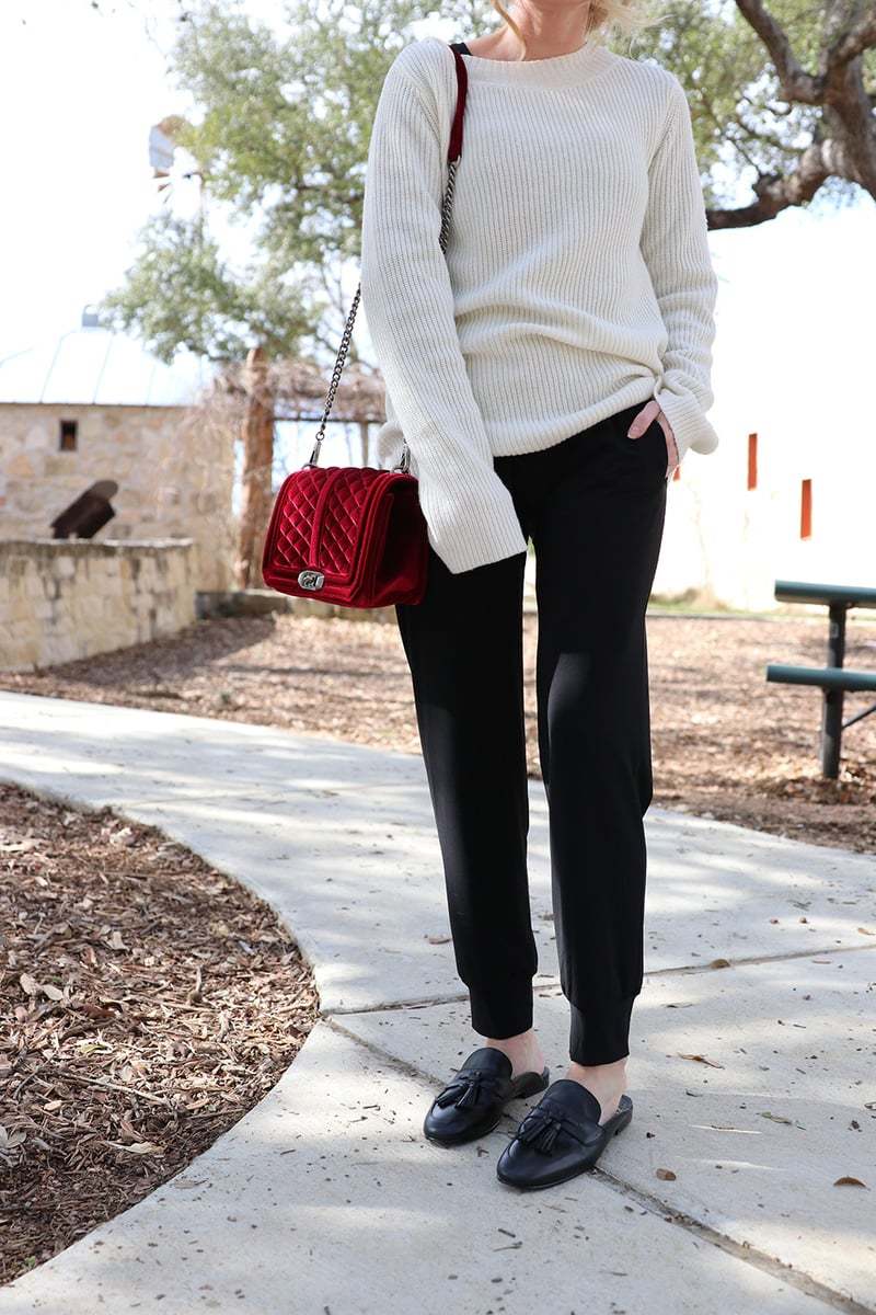 the velvet bag by rebecca minkoff adds a dressy and elegant element to an otherwise pretty casual and sporty outfit. This is one way to try the athleisure trend. The laceup detailing on the ALC sweater is another sporty touch
