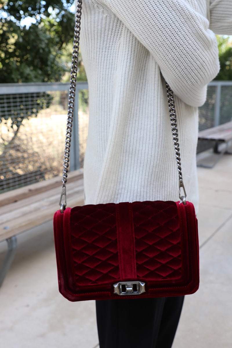 this ALC white sweater with a laceup back is sporty and incredibly chic and comfortable. The oversized slouchy sweater looks great paired with jogging pants by norma kamali. The velvet love crossbody bag by rebecca minkoff adds a dash of sophistication and pop of color