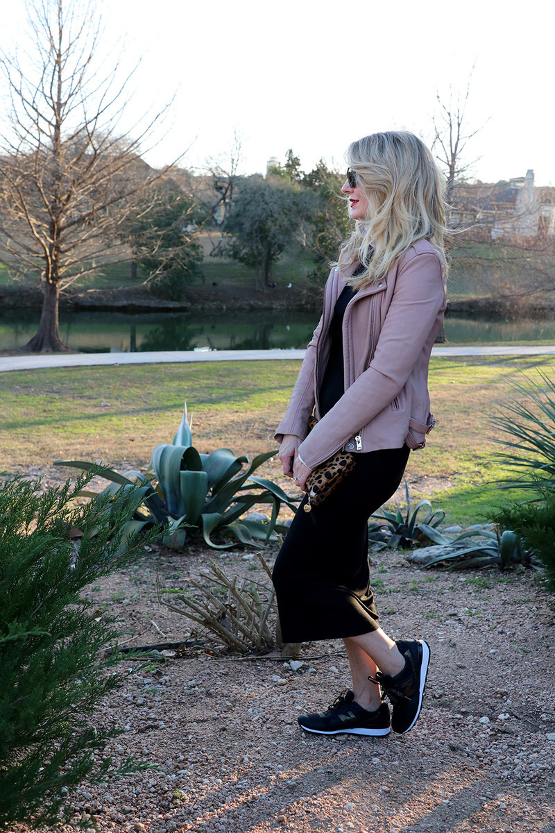 erin busbee of busbeestyle.com showing you one way to try the athleisure trend: add some chic sneaks to your jersey dress and layer a moto jacket over the dress
