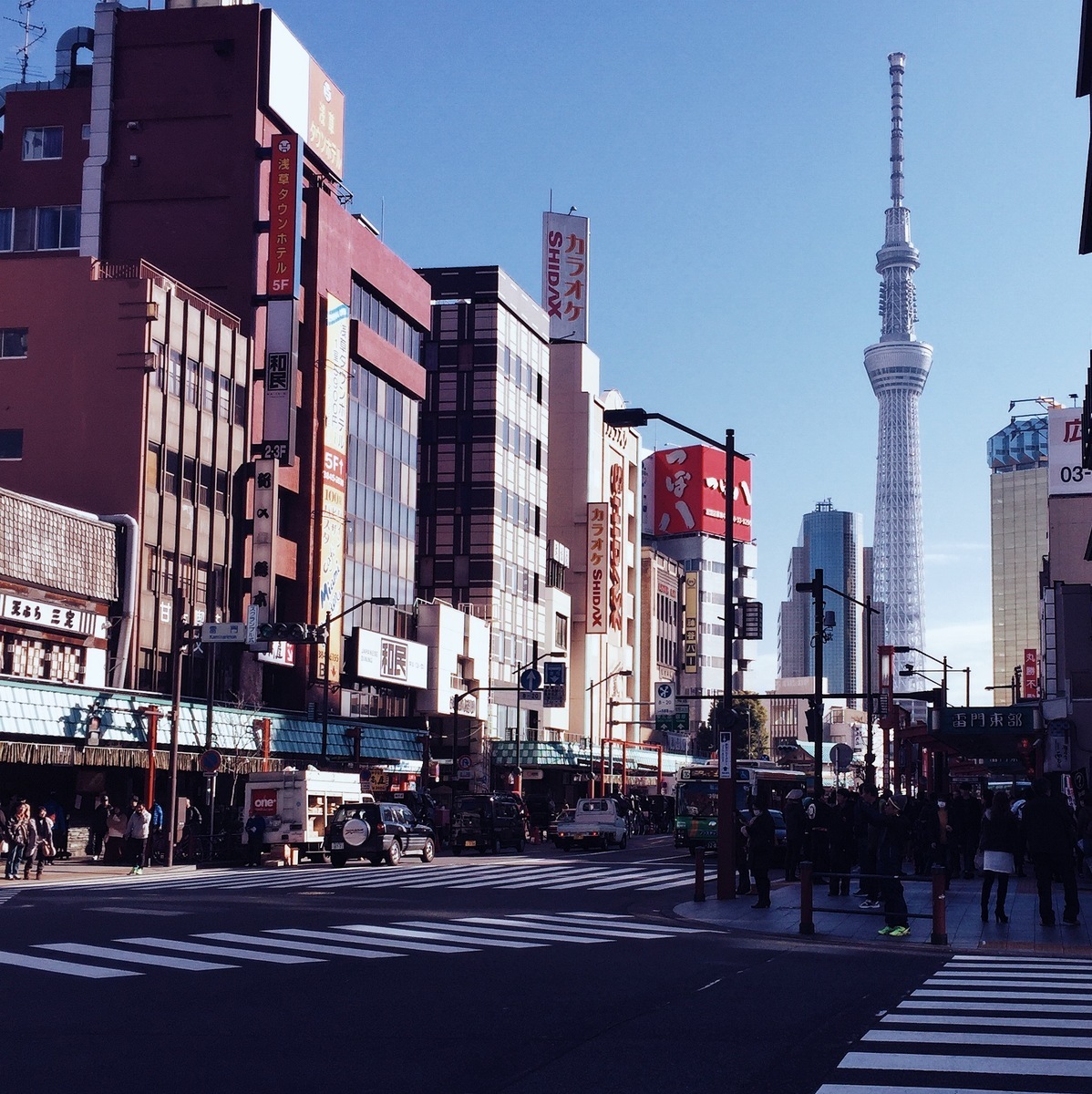 city streets in tokyo with a view of the stunning sky tower