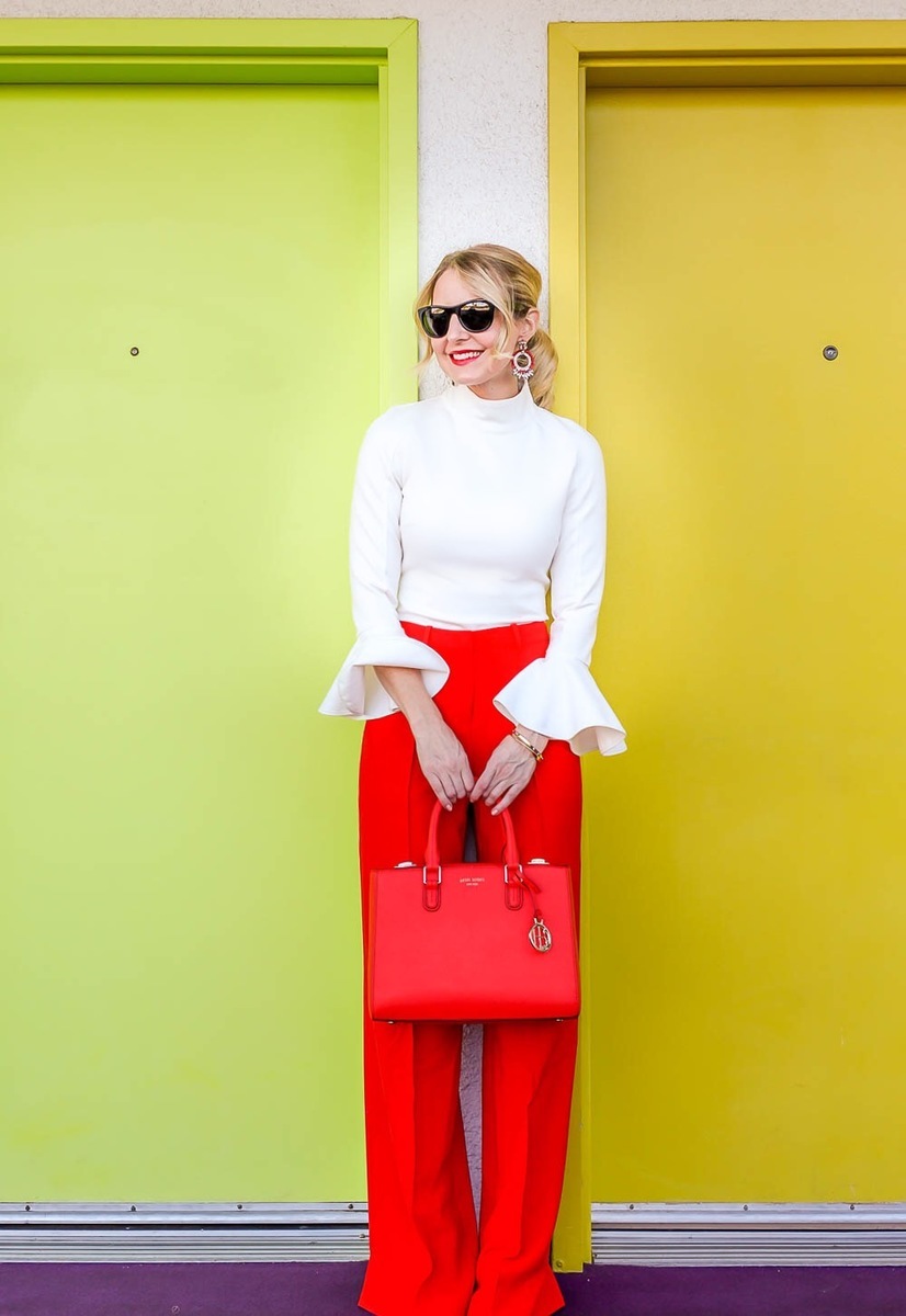 Bright Pants by BCBG really pack a punch... the bold red shade will standout against the chic, white, bell sleeve top from chicwish. I love that 'matching' is back so I was excited to pair this red henri Bendel bag with the pants