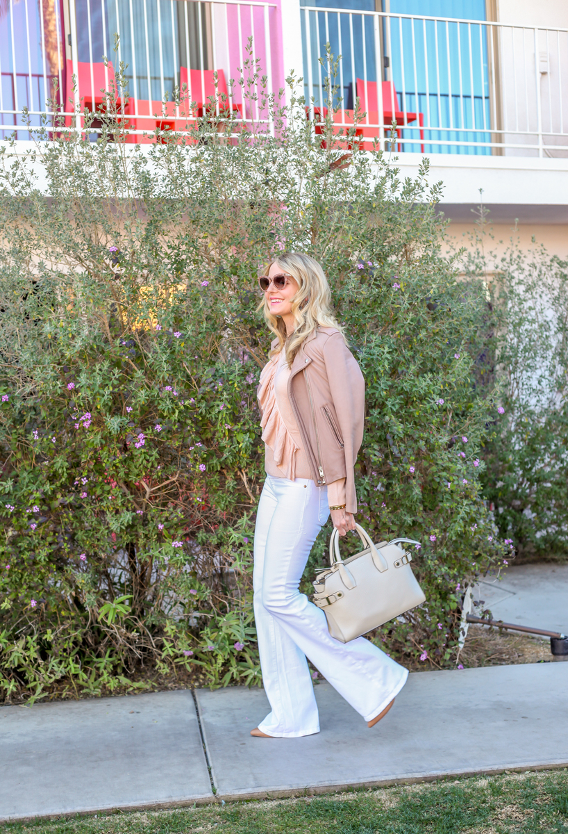 Ruffles - erin busbee from busbeestyle.com in palm springs for alt summit wearing wide leg white jeans, a ruffle peach sweater by topshop and an iro jacket called "Han" in taupe carrying a Henri Bendel handbag in sea salt white