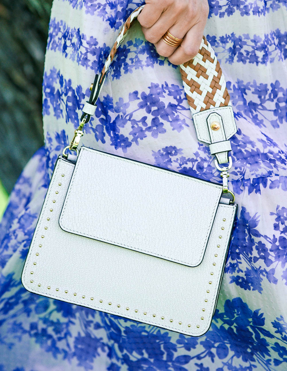 White bag from Henri Bendel. This tini, woven handle, crossbody bag with small gold studs from Henri Bendel is the perfect size for your next special event or wedding. Featured by Erin Busbee, fashion blogger and youtuber for busy women over 40 from Busbee Style