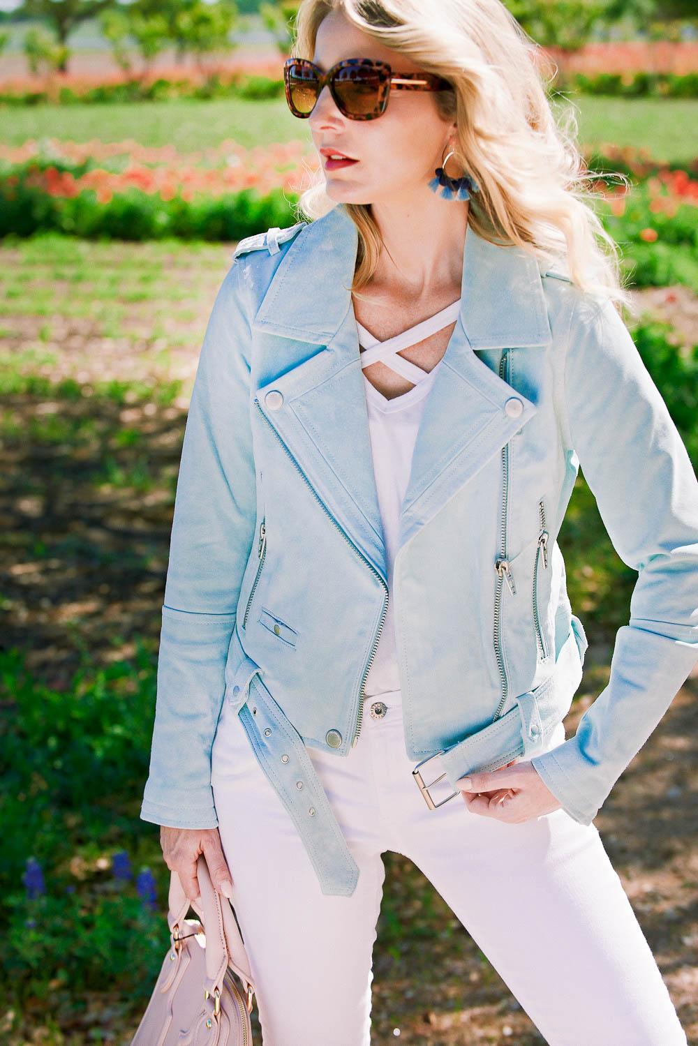 3 ways to wear a moto jacket. This moto jacket in mint green by Blank NYC comes in 8 colors. I paired it with white jeans by AG and a white cross front tee by Socialite 