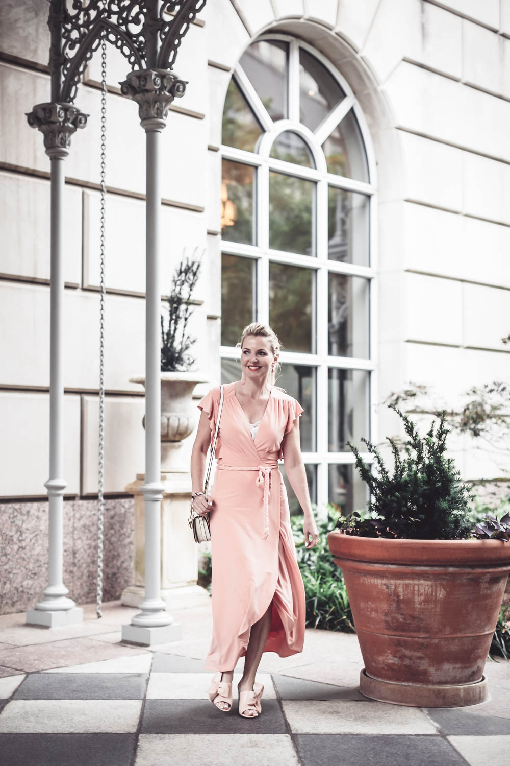 Peach dress by Misa from Revolve Clothing on fashion blogger and youtuber, Erin Busbee, San antonio, Texas, at the Crescent hotel in Dallas for the Reward style conference 
