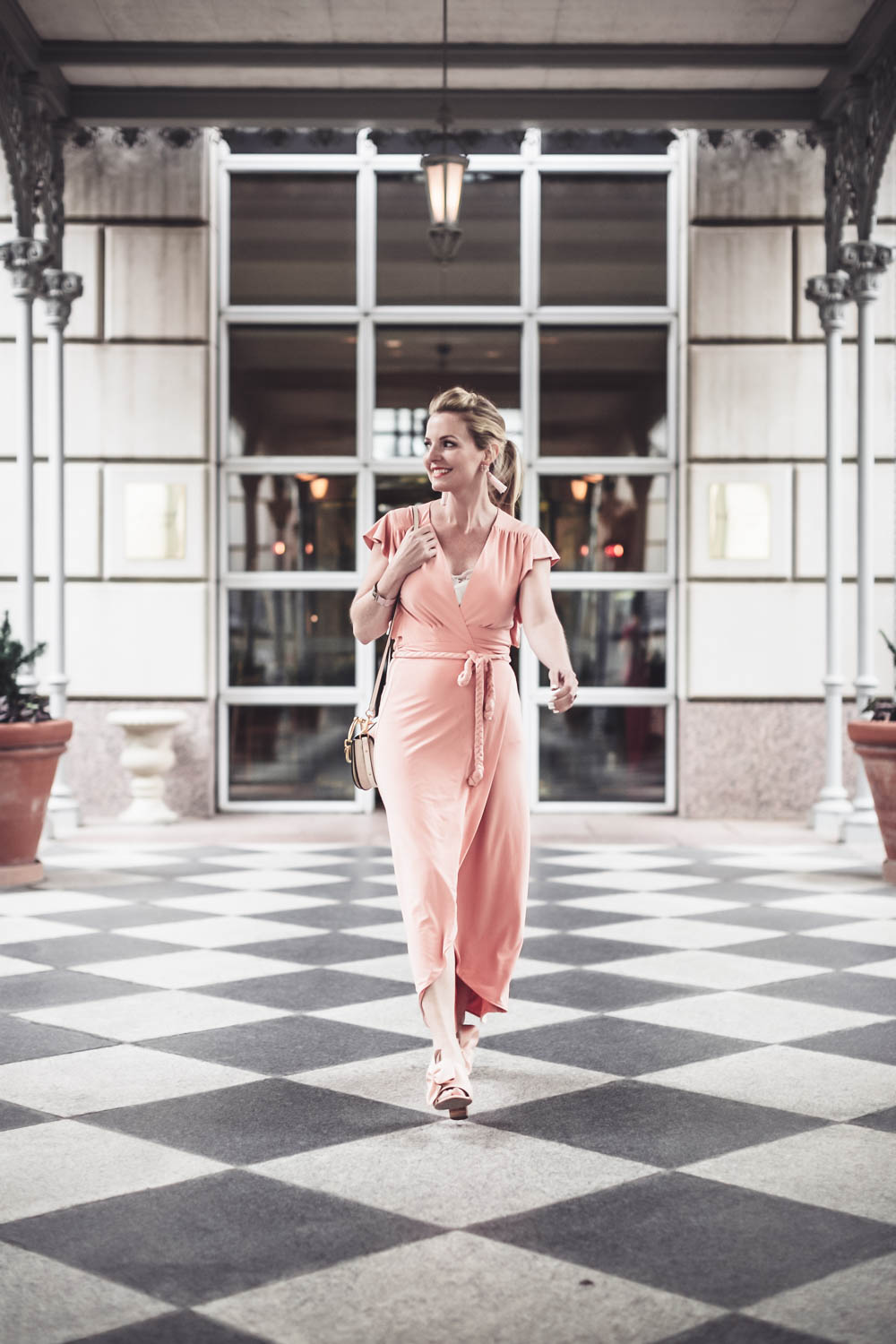 Peach dress by Misa from Revolve Clothing on fashion blogger and youtuber, Erin Busbee, San antonio, Texas, at the Crescent hotel in Dallas for the Reward style conference 