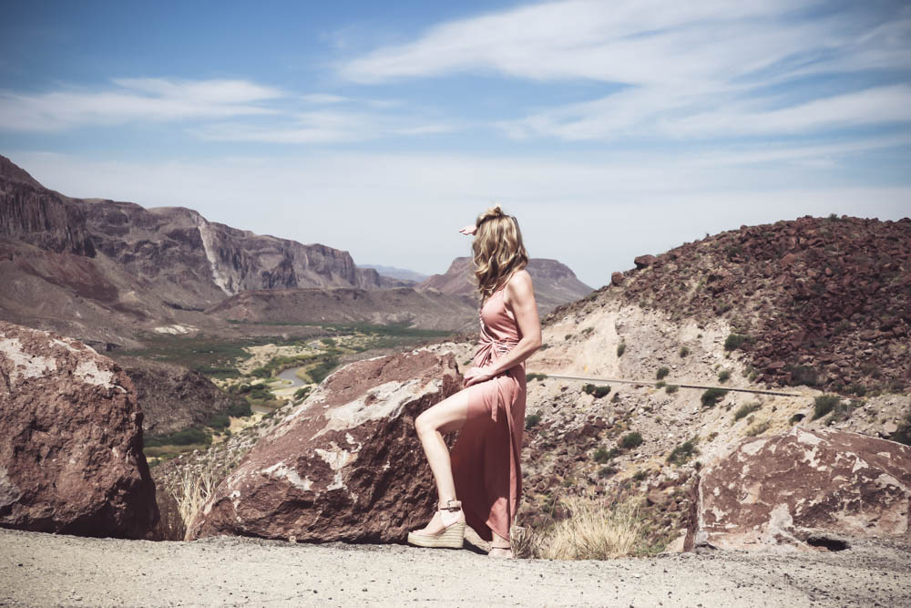 Wrap Dress in blush nude color on fashion blogger and fashion youtuber erin busbee of busbestyle, san antonio, texas, shot near Big Bend National Park in West Texas along the Rio Grande, showing off a LOT of leg!