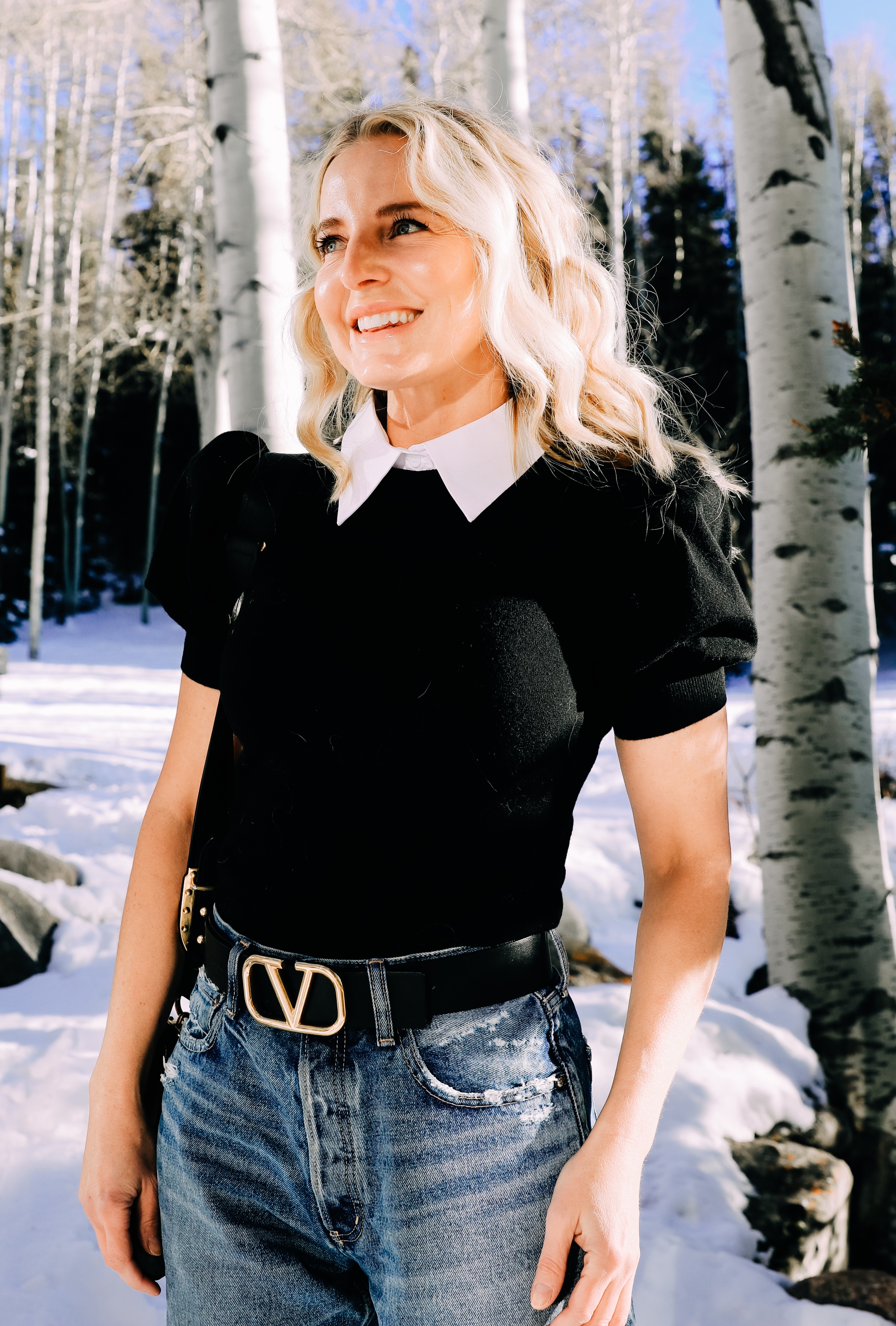 Spring and summer fashion trends, erin busbee of busbee wearing a statement collar sweater by alice + olivia with baggy jeans in telluride colorado