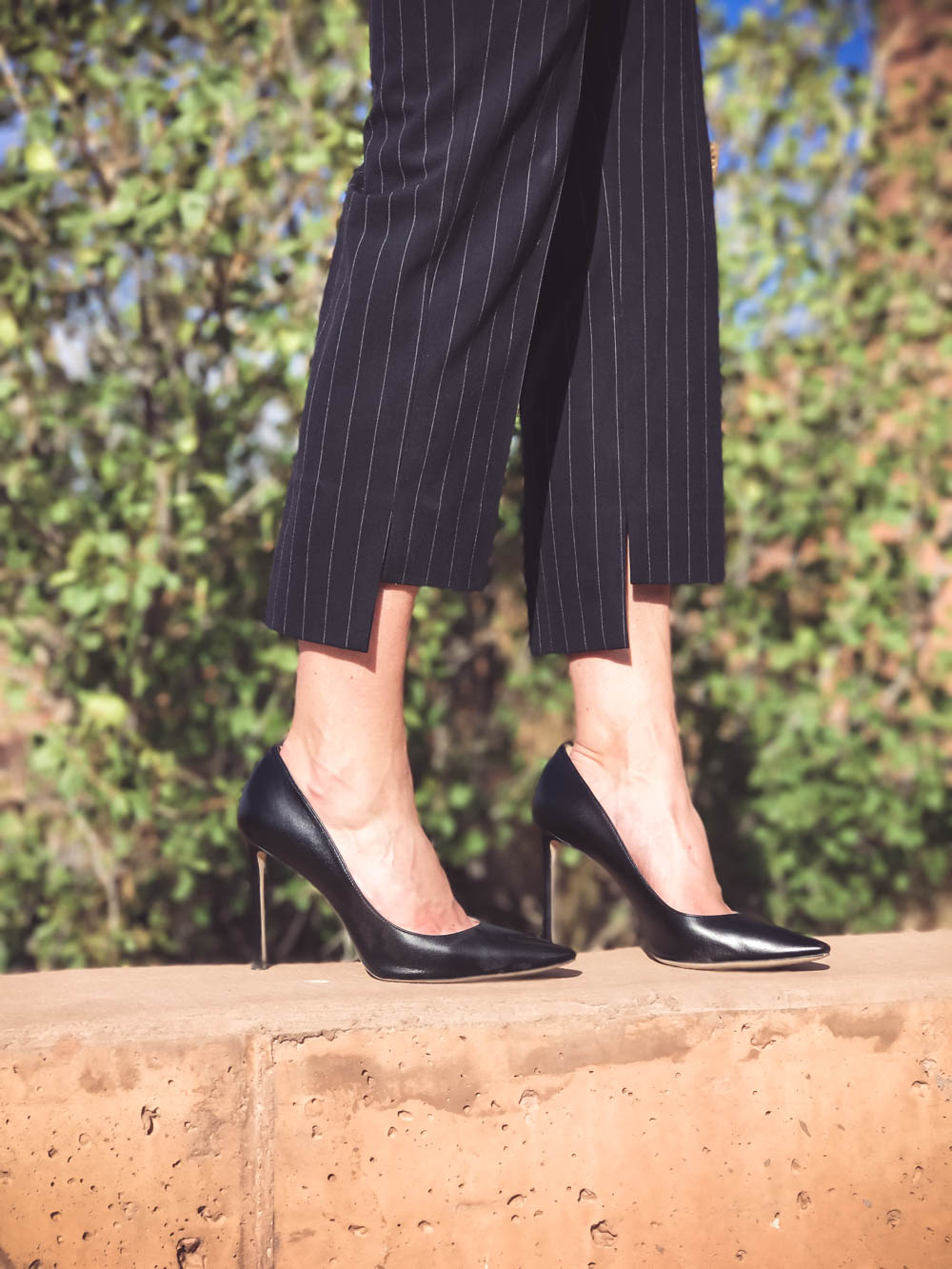 Business Casual Outfit ideas, cropped pants to work, pinstripe cropped pants with black blazer and white choker blouse with black jimmy choo pumps in Moab, Utah on fashion blogger, Erin Busbee, Busbee Style