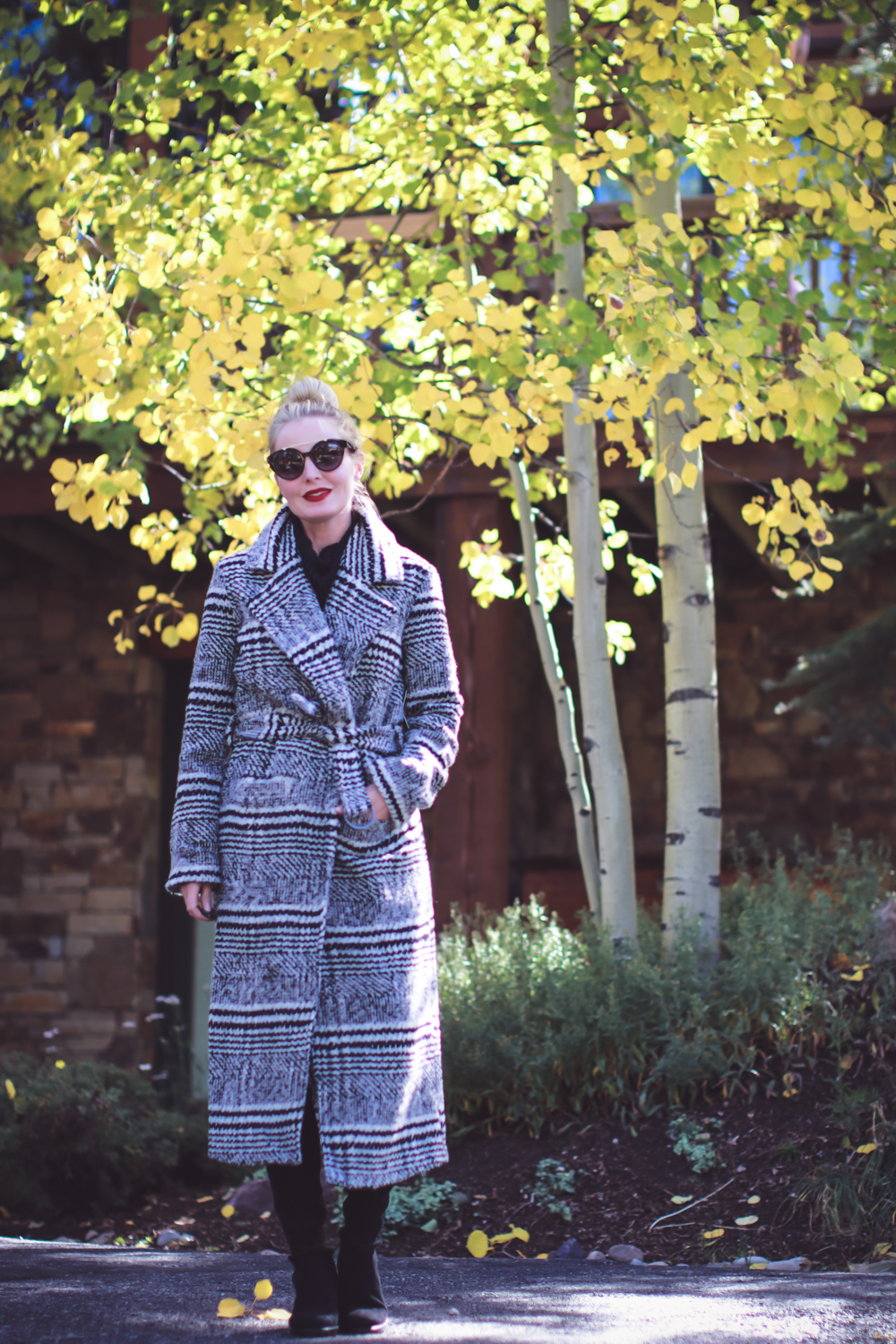 Fall Outfit Ideas, fashion blogger, Erin Busbee of Busbee Style wearing a Lovers + Friends plaid coat belted over an all black faux leather legging look with lowland stuart weitzman boots