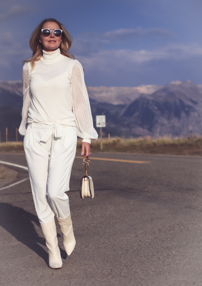 white boots, how to wear white boots, fashion blogger, erin busbee of busbee style from telluride, colorado shows us three outfit ideas, wearing vince camuto white turtleneck, parker white pants, white boots by Dolce Vita and a chloe nile bag