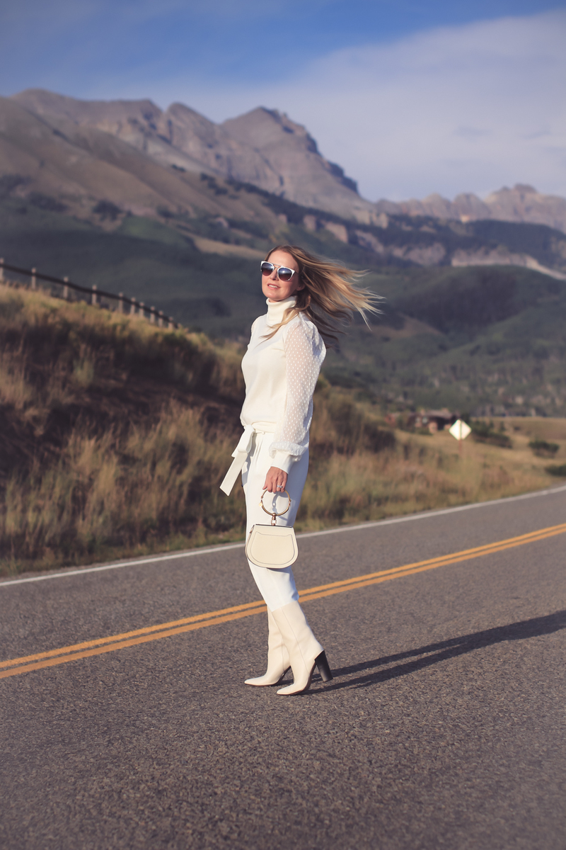 white boots, how to wear white boots, fashion blogger, erin busbee of busbee style from telluride, colorado shows us three outfit ideas, wearing vince camuto white turtleneck, parker white pants, white boots by Dolce Vita and a chloe nile bag