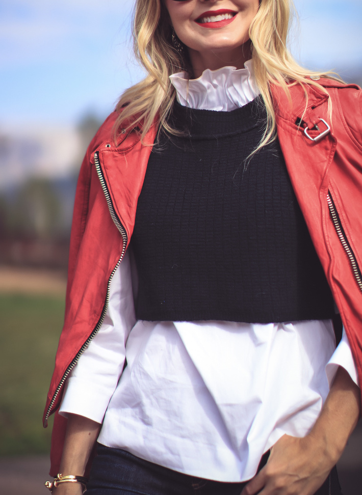 Red moto jacket by Doma, layered over a black free people sweater vest, halogen white ruffle neck blouse on colorado fashion blogger Erin Busbee of Busbee Style, Fashion over 40