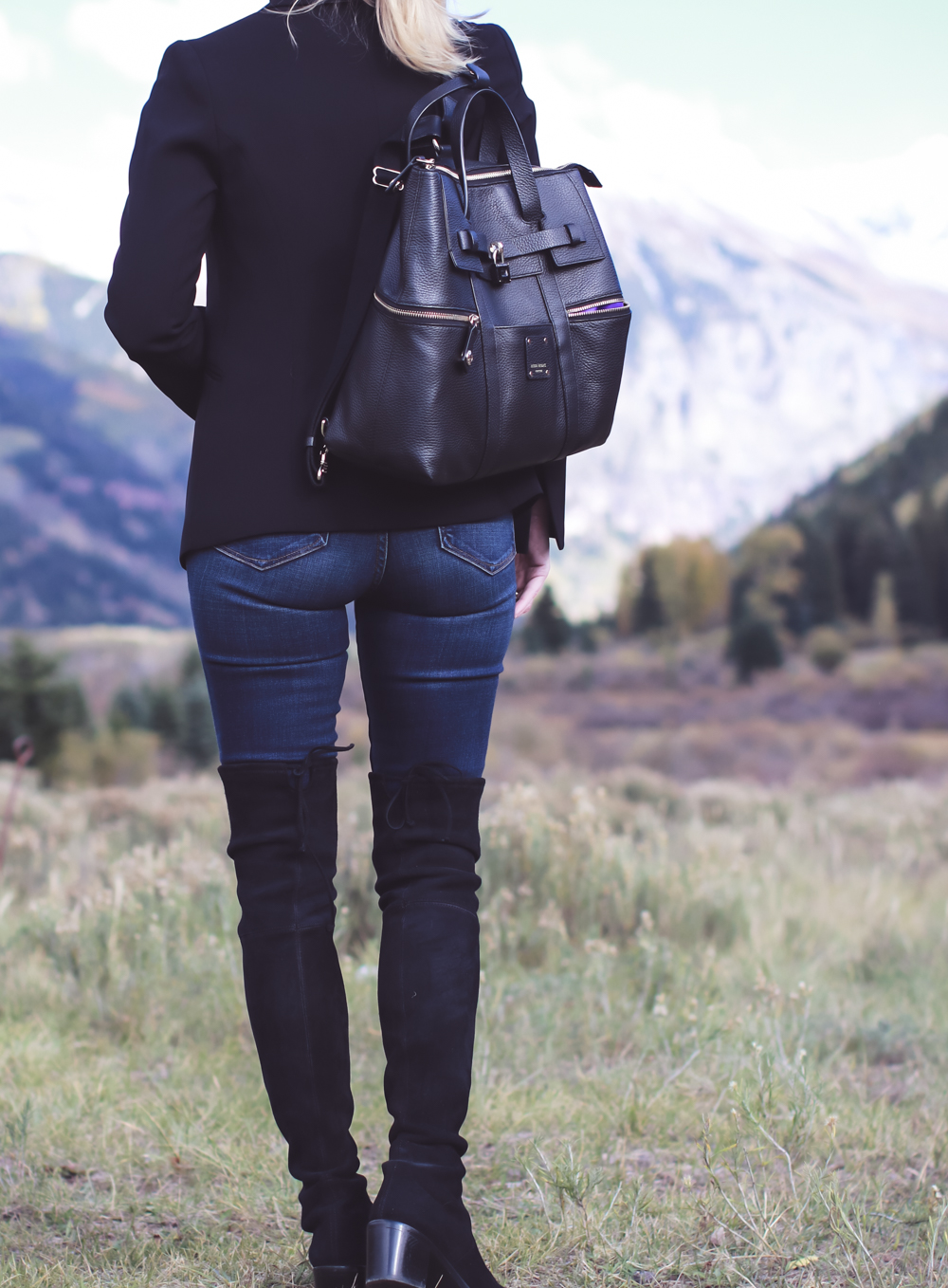 Tall Boots, over the knee boots, how to wear otk boots if you are tall or petite, featuring fashion blogger, Erin Busbee of Busbee Style in Telluride, Colorado, wearing Stuart Weitzman lowland boots , carrying Henri Bendel Jetsetter backpack