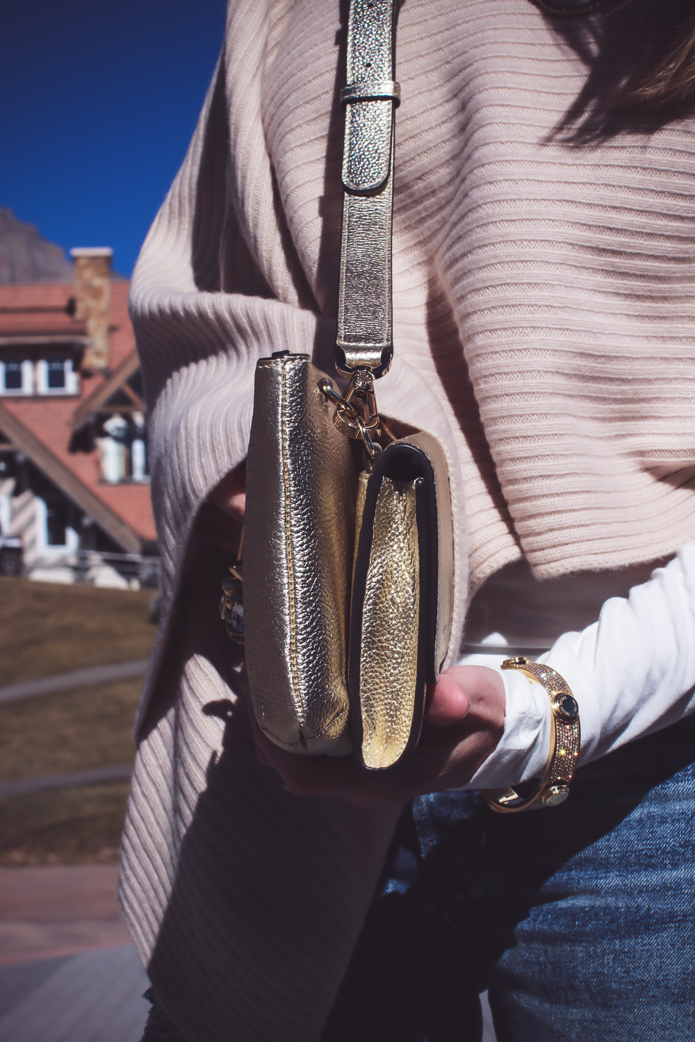 Personalize your handbag like a charm necklace with Henri Bendel, Erin Busbee, fashion blogger from Busbee Style shows you one 2-in-1 bag option (wallet and crossbody bag) with charms unique to her in Telluride Colorado