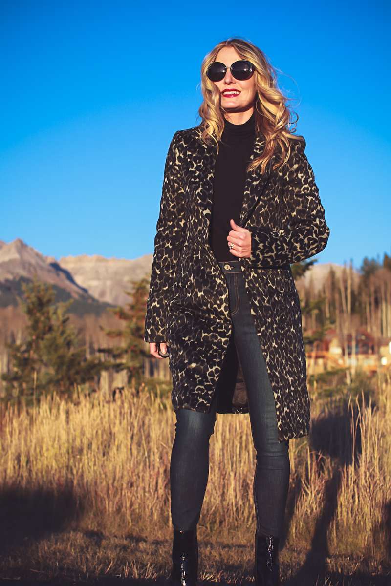 Black turtleneck outfit ideas for this wardrobe basic by Eileen Fisher from Bloomingdales, featuring an animal print coat by Bardot, Rag & Bone dark wash skinny jeans, and Vince Camuto patent black booties, Fashion Blogger Erin Busbee of Busbee Style