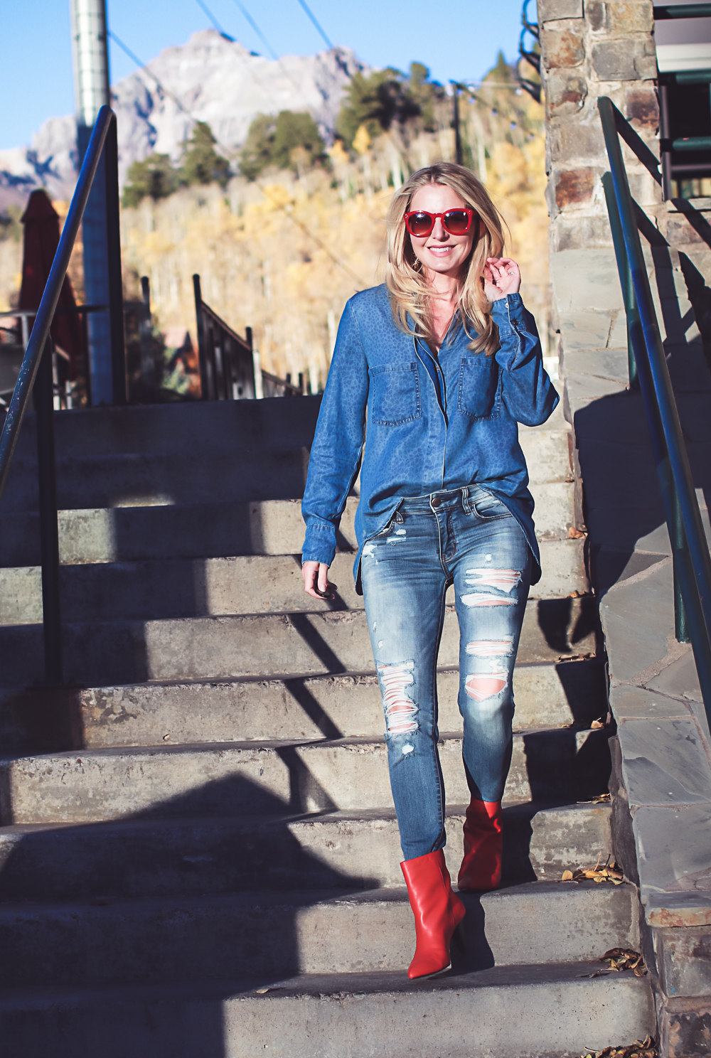 How to wear red boots, red booties by Dolce Vita with denim on denim look, American Eagle jeans, Bella Dahl chambray shirt, on fashion blogger over 40, Erin Busbee of Busbee Style in Mountain Village, Colorado