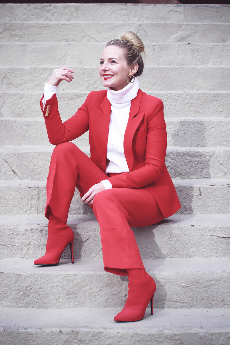 How to wear red from head to toe featuring fashion blogger over 40, Erin Busbee of Busbee Style in Telluride, Colorado wearing a Smythe suit and Steven Madden sock booties