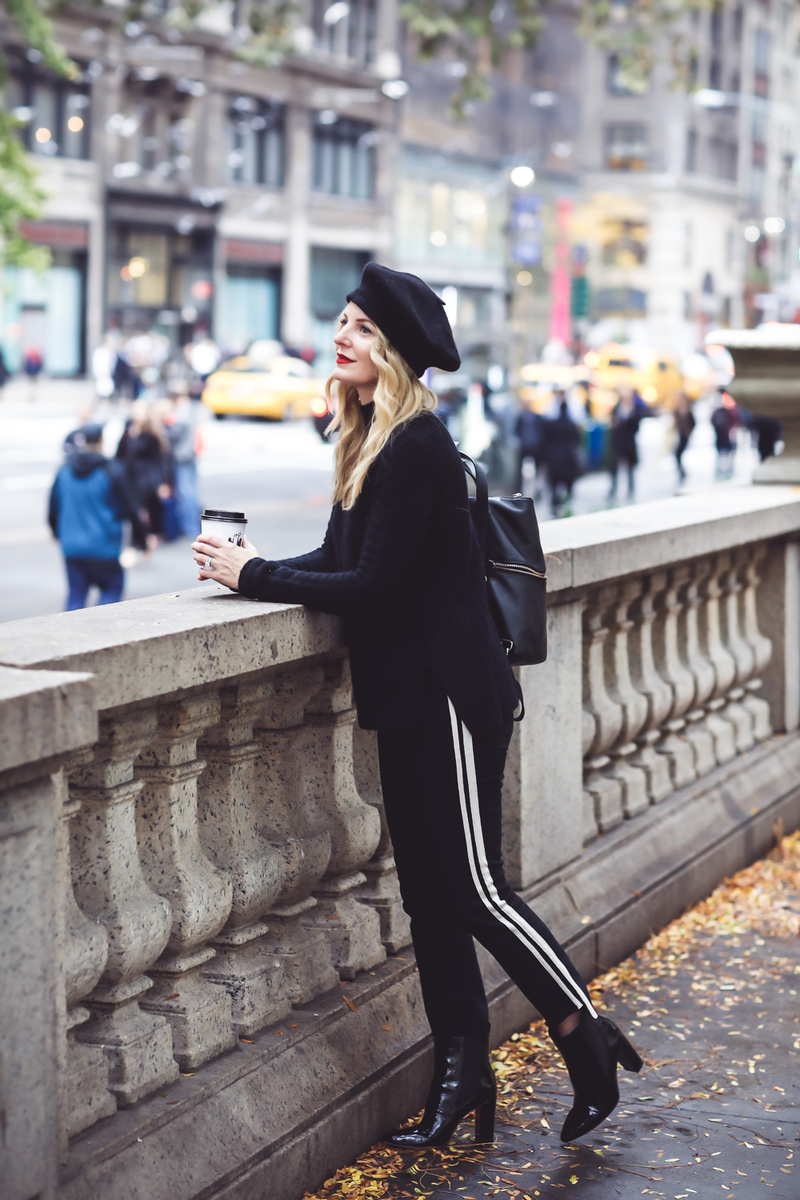 Beret, how to style a beret, how to look french, Erin Busbee of Busbee Style, fashion blogger over 40, walking in NYC with her black beret and all black look including Mother striped jeans, vince camuto patent booties and aqua cashmere choker sweater