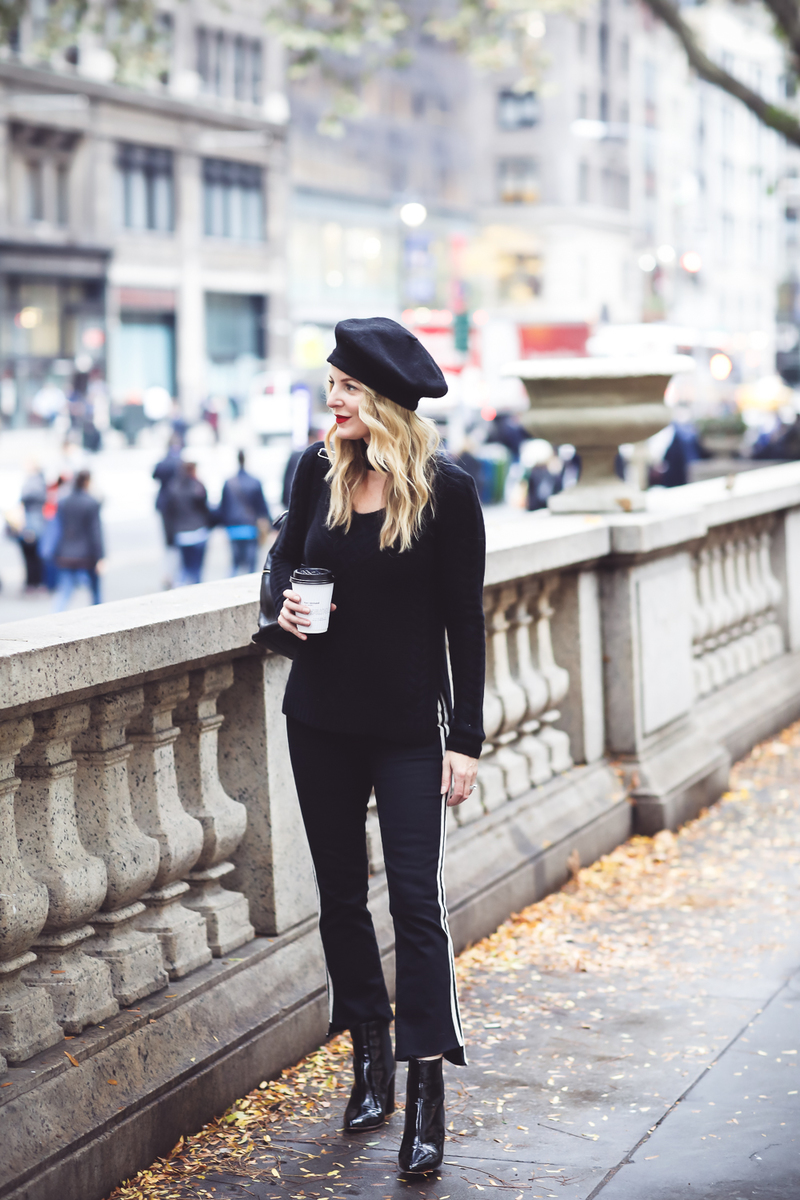 Beret, how to style a beret, how to look french, Erin Busbee of Busbee Style, fashion blogger over 40, walking in NYC with her black beret and all black look including Mother striped jeans, vince camuto patent booties and aqua cashmere choker sweater