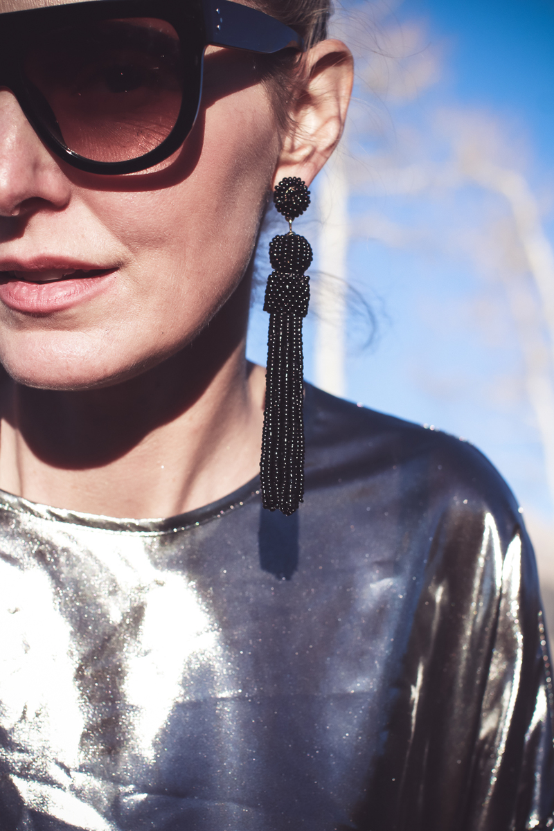 Silver Lame Top For New Year's Eve, how to style a metallic, liquid metal, silver top by Topshop featuring fashion blogger over 40, Erin Busbee wearing baublebar black tassel earrings