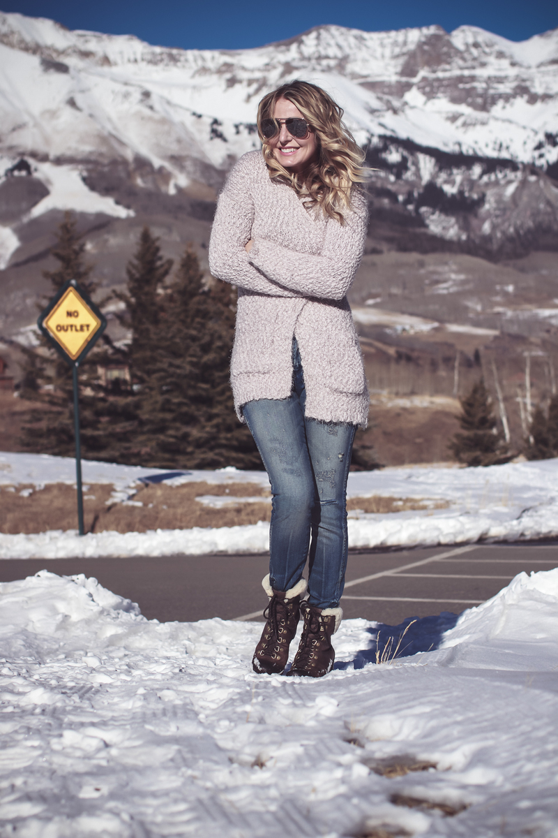Fuzzy Cardigan sweater paired with Sorel Conquest boots, AMO twist jeans, on fashion blogger over 40, Erin Busbee of Busbee Style in Mountain Village, Telluride Colorado 