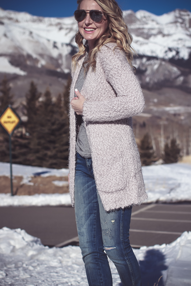 Fuzzy Cardigan sweater in beige from Nordstrom, paired with Sorel Conquest boots, AMO twist jeans, on fashion blogger over 40, Erin Busbee of Busbee Style in Mountain Village, Telluride Colorado