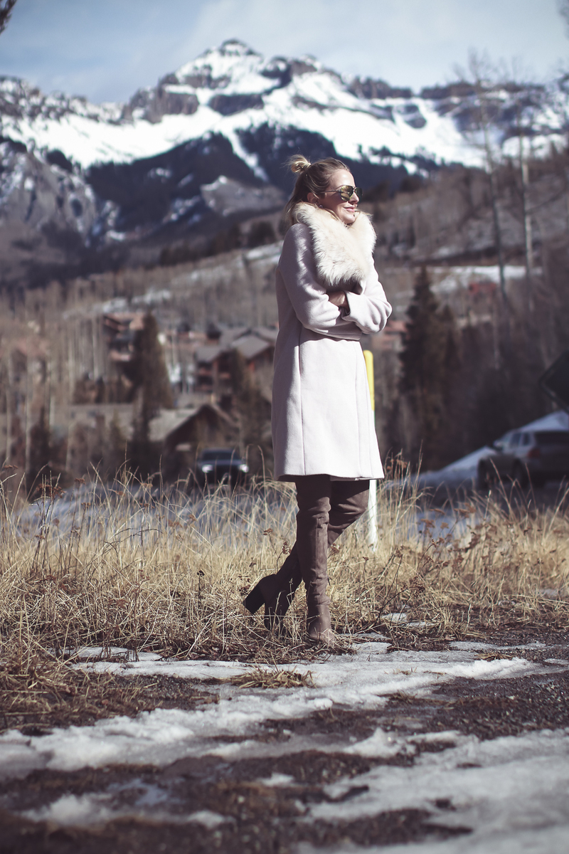 Faux Fur Coat, glam winter coat option in pale pink by Club Monaco on Fashion blogger, Erin Busbee of BusbeeStyle.com and Busbee Style in Telluride, Colorado with over the knee suede, Marc Fisher boots and white jeans