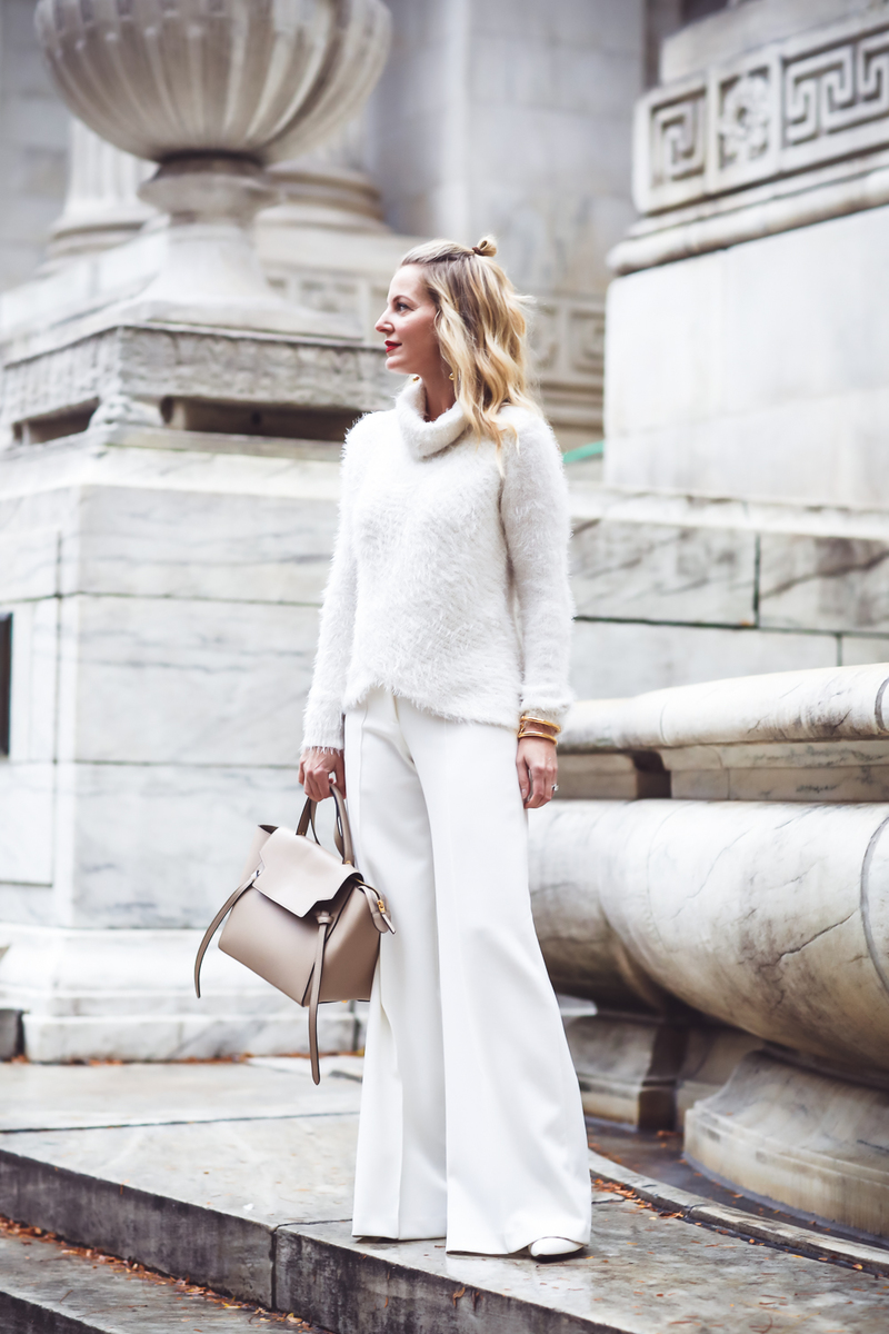 Erin Busbee of Busbee Style wearing an all white look with wide leg white pants and white sweater