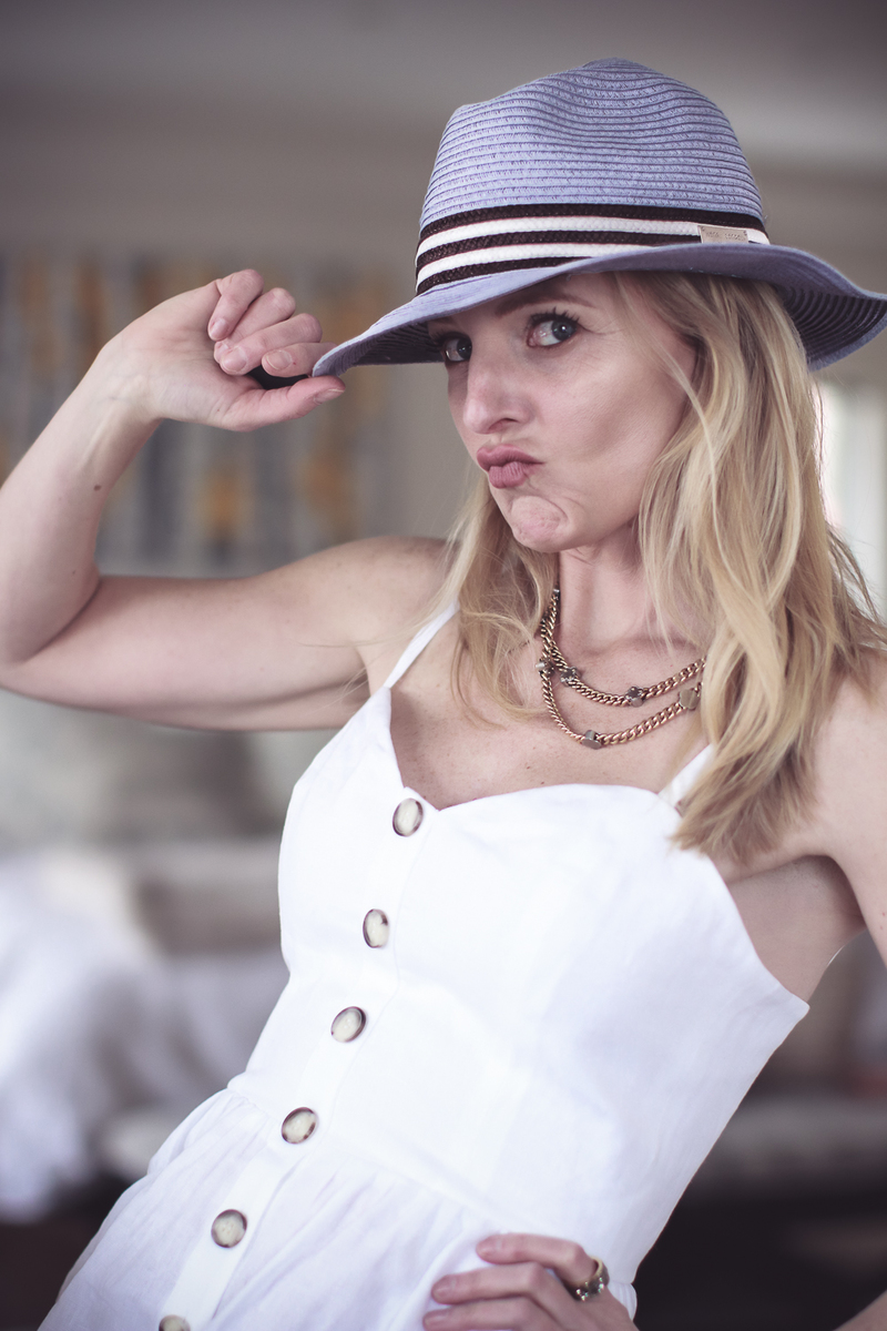 Best accessories featuring a packable panama hat in blue and brown stripes from Henri Bendel on fashion blogger over 40 Erin Busbee of BusbeeStyle.com 