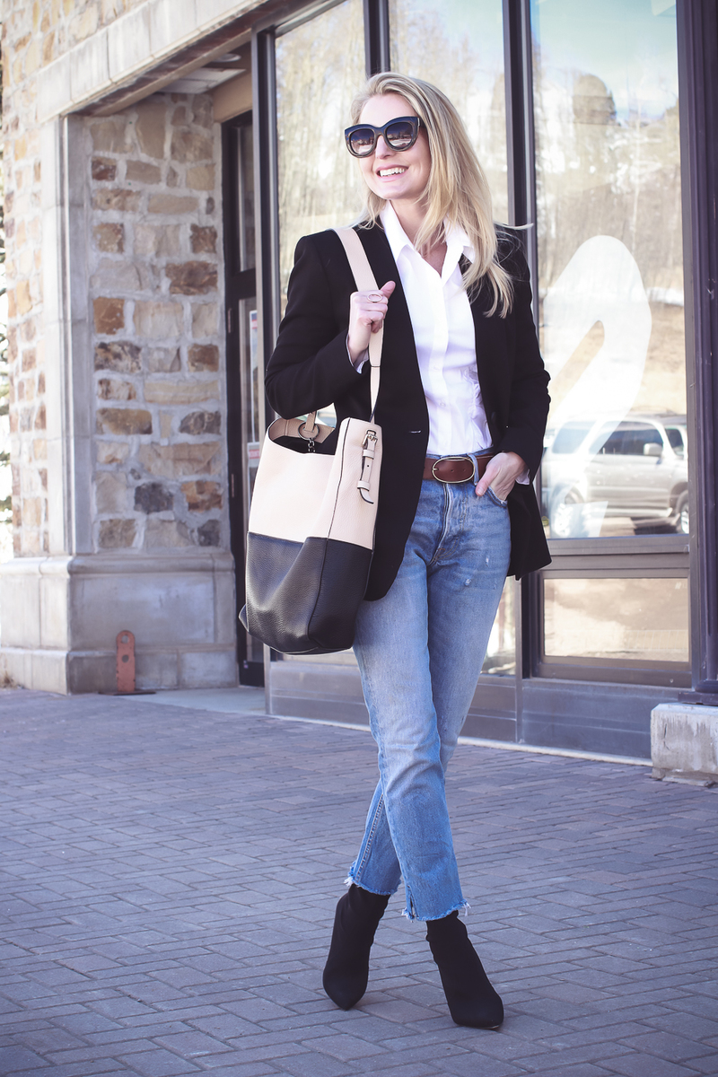 Blazer 2 Ways on fashion blogger over 40, Erin Busbee of Busbee Style wearing Madewell black blazer, Moussy tapered jeans, white button down and Henri bendel color block tote with Hifi Stuart Weitzman black sock booties