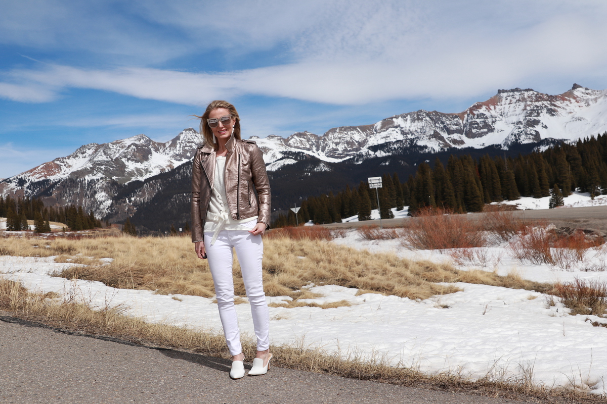 White Vince Camuto mules, white AG jeans, metallic moto jacket, light layers for spring