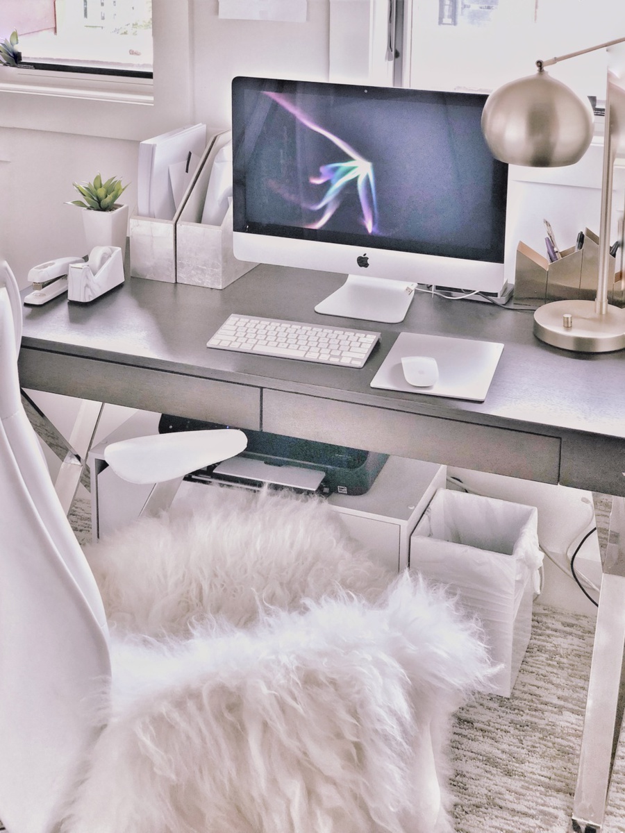 organizational tips by lifestyle blogger Erin Busbee of Busbee Style sharing her office space with sheepskin rug, lamp from Target, magazine bins from West Elm