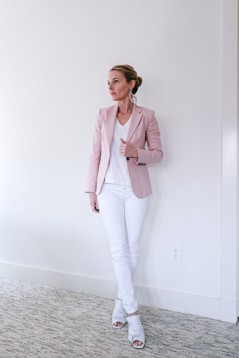 white skinny jeans with a vince camuto laceup detail pink blazer, white tee by Madewell, white AG skinny jeans and mules by Marc Fisher on fashion blogger over 40 Erin BUsbee of BusbeeStyle.com