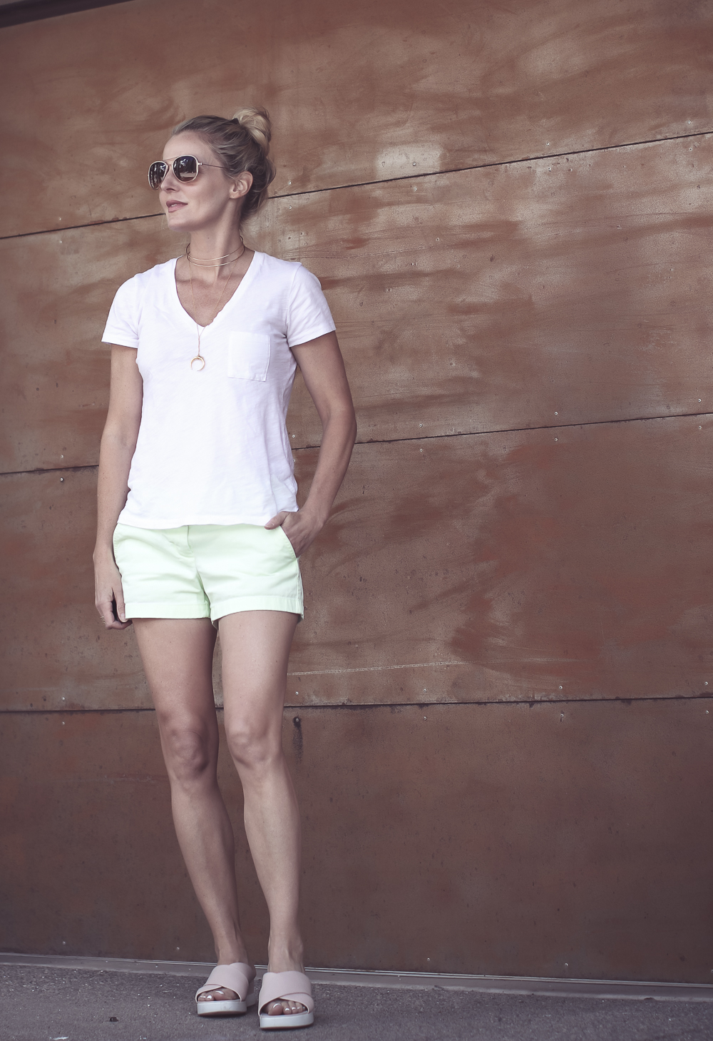 Comfortable sandals, slides by ECCO on blonde woman wearing J.Crew chino 4 inch inseam shorts and a Madewell white v-neck tee