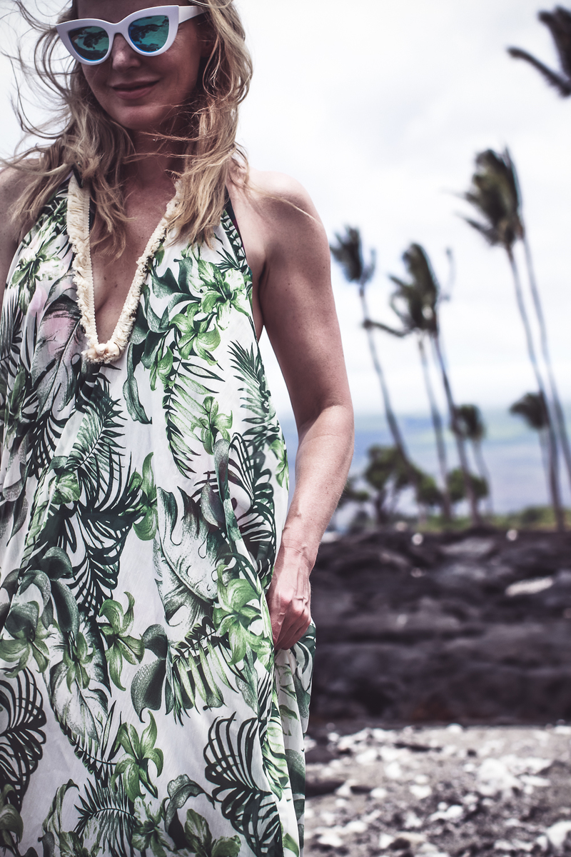 palm print flowy beach coverup from Everything but water on blond woman with retro white sunglasses on blond woman