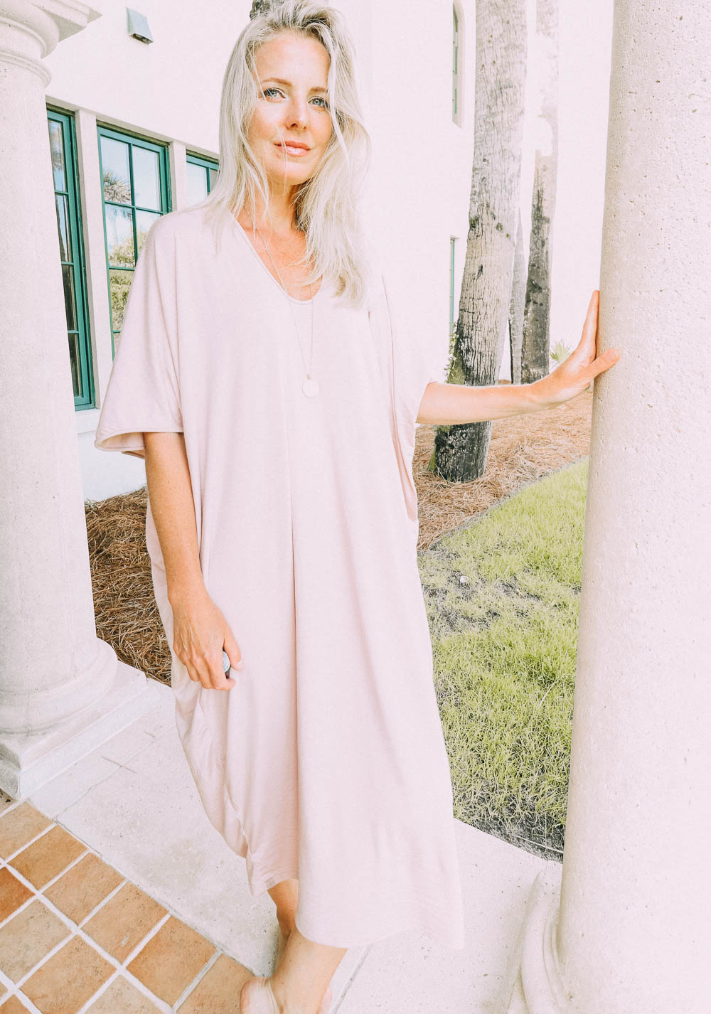 best pajamas, blush toned caftan by Barefoot Dreams on blonde woman