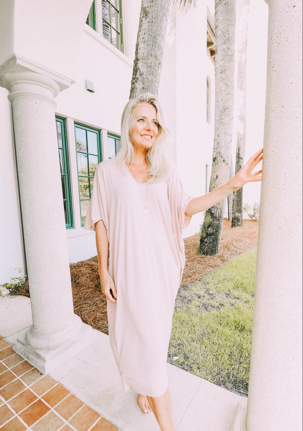 best pajamas, blush toned caftan by Barefoot Dreams on blonde woman