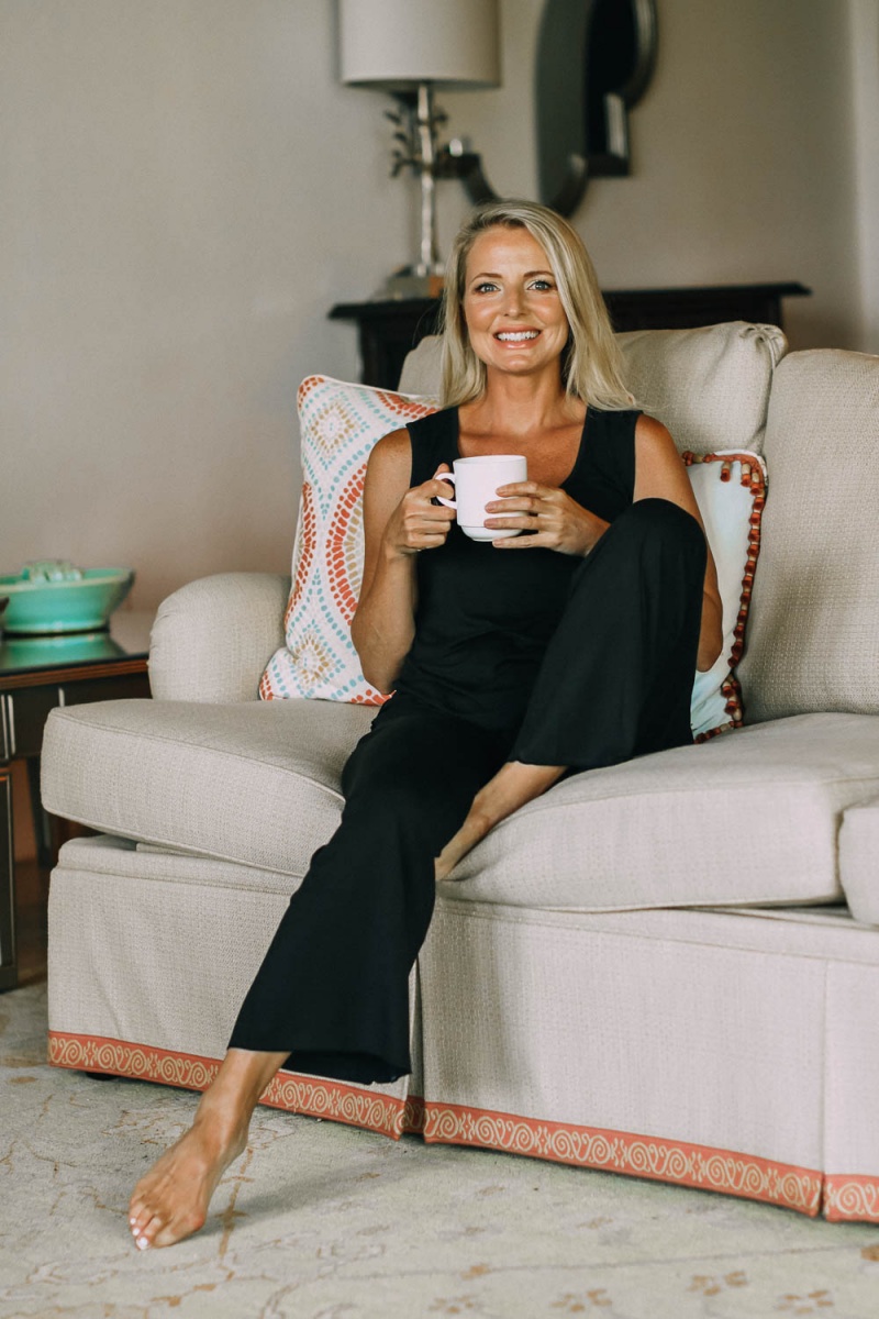 best pajamas, black luxe jersey sleeveless top and cropped pants pajamas set by Barefoot Dreams on blonde woman