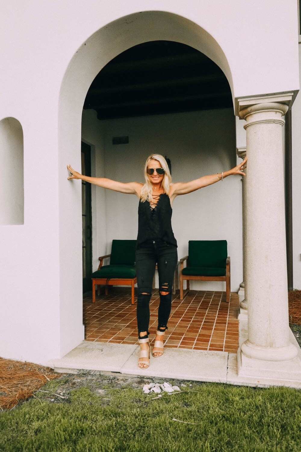 Cami styled 2 ways, featuring a WAYF laceup black cami with black distressed lovers + friends jeans and vince camuto velcro closure sandals