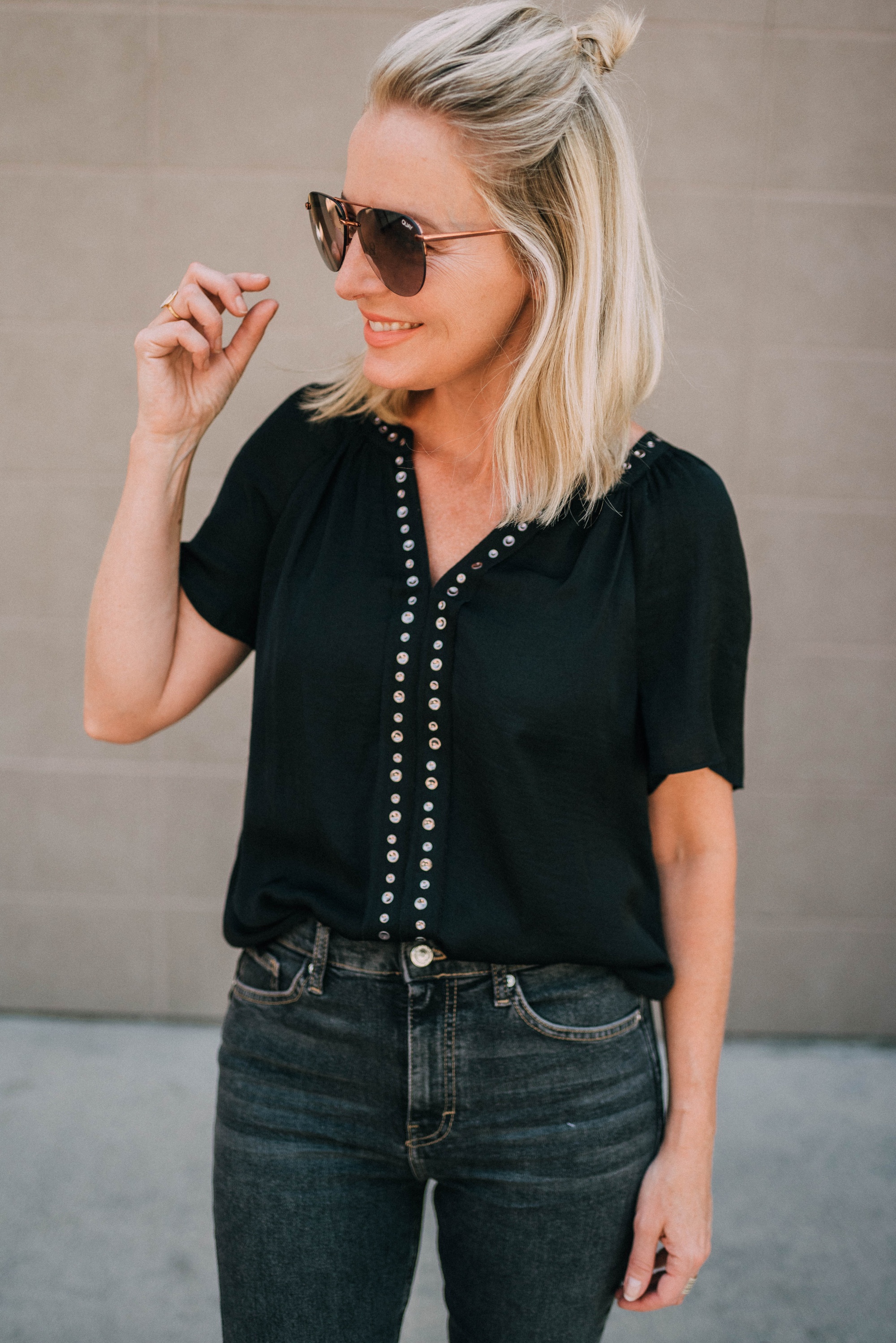 nordstrom sale basics 2019 featuring vince camuto black short sleeve blouse with grommets on fashion blogger Erin busbee