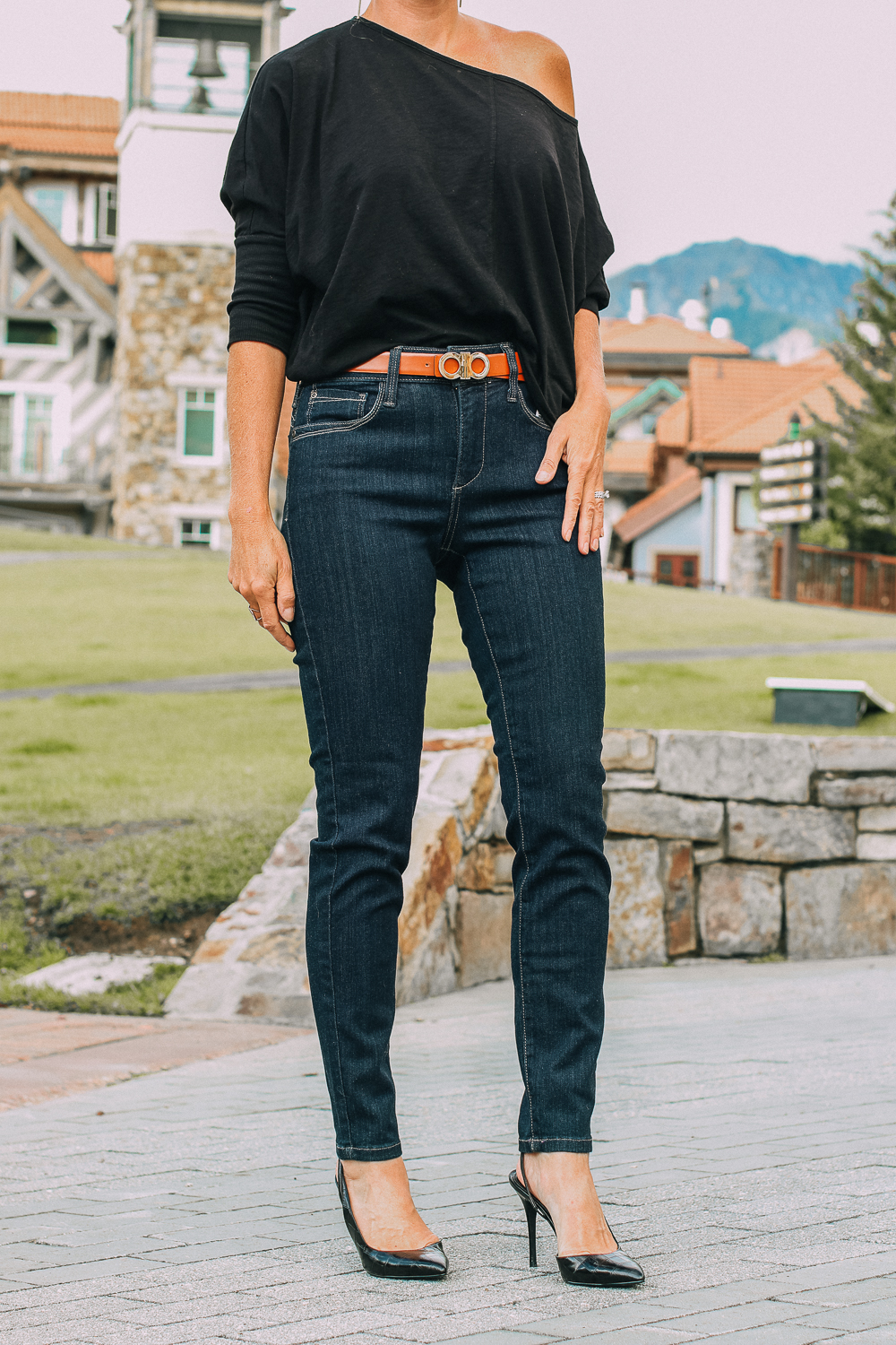 Best Jeans for Curves by Not Your Daughter's Jeans or NYDJ paired with black of shoulder dolman top, Quay aviator sunglasses, gold earrings on fashion blogger over 40, Erin Busbee of busbee style