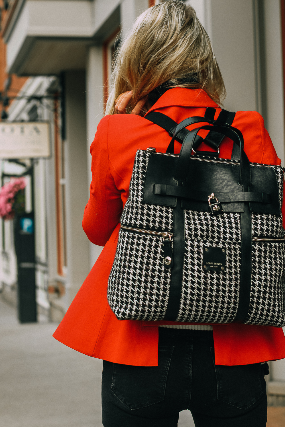 Fall Statement Handbags 2018, this black houndstooth Henri Bendel Jetsetter convertible bag is SO chic, Paired with a red Smythe dutchess blazer, black cropped Mavi jeans and Stuart Weitzman booties