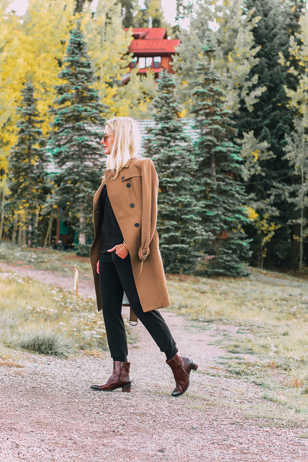 ankle boots for walking in Bison brown with low block heel and comfort, cushion technology by ECCO on fashion blogger in black joggers by Norma Kamali and black off shoulder top with brown crossbody bag